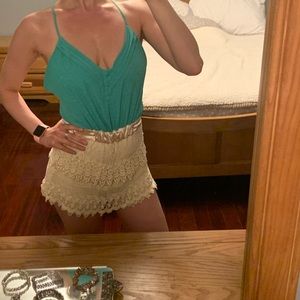 Green and ivory romper with open back